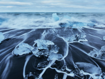 Icy waves on a sandy beach